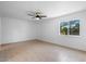 Bright bedroom featuring a ceiling fan and large window at 4400 N 20Th St, Phoenix, AZ 85016