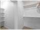 Walk-in closet with built-in shelving at 4400 N 20Th St, Phoenix, AZ 85016