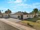 Charming single-Gathering home showcasing solar panels, manicured lawn, and modern exterior design at 4400 N 20Th St, Phoenix, AZ 85016