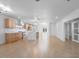 Spacious kitchen with island, stainless appliances, and open floor plan at 4400 N 20Th St, Phoenix, AZ 85016