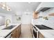 Elegant kitchen featuring marble countertops, custom cabinets, a modern faucet, and sleek stainless steel appliances at 4400 N 20Th St, Phoenix, AZ 85016