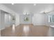 Open and airy living room with great natural light and modern finishes, seamlessly connecting to other living spaces at 4400 N 20Th St, Phoenix, AZ 85016