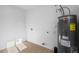 Clean utility room with modern water heater and neutral tile flooring at 4400 N 20Th St, Phoenix, AZ 85016