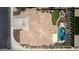 Aerial view of property with pool, backyard seating, and desert landscaping at 4423 W Lodge Dr, Laveen, AZ 85339