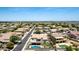 Aerial view shows the home in a mature, developed community at 4423 W Lodge Dr, Laveen, AZ 85339