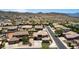 Aerial view of homes in a suburban community with mountain views and desert landscaping at 4423 W Lodge Dr, Laveen, AZ 85339