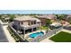 Beautiful backyard featuring a private pool, outdoor kitchen, lush lawn, and patio area, perfect for entertaining at 4423 W Lodge Dr, Laveen, AZ 85339