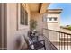 This balcony features a seating area with a table, chairs, and views of the property at 4423 W Lodge Dr, Laveen, AZ 85339