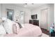 This bedroom features wood floors, neutral walls and a large dresser at 4423 W Lodge Dr, Laveen, AZ 85339