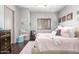 Adorable bedroom featuring a pink bed, wood floors, and lots of decor at 4423 W Lodge Dr, Laveen, AZ 85339