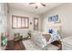 bedroom with wood floors, plantation shutters, and customized decor at 4423 W Lodge Dr, Laveen, AZ 85339