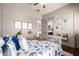 This bedroom features wood floors, a crib and an attached bath at 4423 W Lodge Dr, Laveen, AZ 85339
