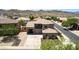 Stunning exterior elevation showcasing a two-story home with a well-manicured front yard and a mountain backdrop at 4423 W Lodge Dr, Laveen, AZ 85339