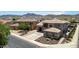 A home with desert landscaping, mountain views, and a well-manicured front yard at 4423 W Lodge Dr, Laveen, AZ 85339