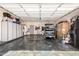 This garage features a golf cart, cabinets, storage, and plenty of parking space at 4423 W Lodge Dr, Laveen, AZ 85339