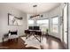 Bright home office featuring hardwood floors, stylish desk, and large windows offering scenic views at 4423 W Lodge Dr, Laveen, AZ 85339