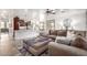Open-concept layout featuring a living room with a plush sectional and a kitchen with a center island at 4423 W Lodge Dr, Laveen, AZ 85339