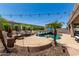Beautiful outdoor pool area with lush landscaping and string lights at 4423 W Lodge Dr, Laveen, AZ 85339