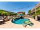 Stunning pool with rock features, mature landscaping, and a view at 4423 W Lodge Dr, Laveen, AZ 85339