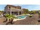 View of the backyard featuring a pool, patio, and desert landscaping at 4423 W Lodge Dr, Laveen, AZ 85339