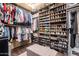 Spacious walk-in closet with custom shelving and hanging racks at 4423 W Lodge Dr, Laveen, AZ 85339