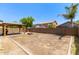 Spacious backyard features wooden gazebo with fire pit and block fencing, perfect for entertaining at 4807 W St Anne Ave, Laveen, AZ 85339