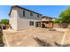 Home backyard features wooden gazebo with fire pit and block fencing, and covered patio access at 4807 W St Anne Ave, Laveen, AZ 85339