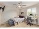 Comfortable bedroom featuring a ceiling fan, carpeted floor, and ample natural light at 4807 W St Anne Ave, Laveen, AZ 85339