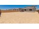 Spacious backyard area with block wall fencing and covered patio, ready for customization at 5023 W Hardtack Trl, Laveen, AZ 85339
