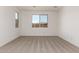 Spacious bedroom with carpet, neutral paint and large windows at 5023 W Hardtack Trl, Laveen, AZ 85339