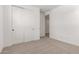Bright bedroom featuring carpeted floors, neutral walls, and closet at 5023 W Hardtack Trl, Laveen, AZ 85339