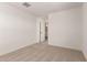 Bright bedroom featuring carpeted floors and ensuite bathroom at 5023 W Hardtack Trl, Laveen, AZ 85339