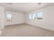 Spacious room boasts neutral carpeting and multiple windows offering neighborhood views at 5023 W Hardtack Trl, Laveen, AZ 85339