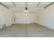 Large, bright two car garage with high ceilings, concrete floor and attached water heater at 5023 W Hardtack Trl, Laveen, AZ 85339