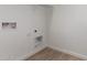 Functional laundry room features white walls and tile flooring at 5023 W Hardtack Trl, Laveen, AZ 85339