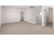 Upstairs bonus room with stairs, access to other rooms, and neutral carpeting at 5023 W Hardtack Trl, Laveen, AZ 85339
