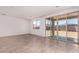 Spacious living room features tile floors and sliding glass doors to the backyard at 5023 W Hardtack Trl, Laveen, AZ 85339