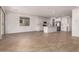 Open concept living space and kitchen with tile floors and neutral paint at 5023 W Hardtack Trl, Laveen, AZ 85339