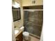 Full bathroom boasts modern tile floors, glass shower door, and granite vanity at 564 N Santa Anna St, Mesa, AZ 85201