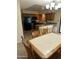 Open dining area features tile floors, chandelier lighting, and access to the kitchen at 564 N Santa Anna St, Mesa, AZ 85201