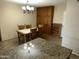 Traditional dining area includes wood furniture, ample lighting and a seamless flow to the kitchen at 564 N Santa Anna St, Mesa, AZ 85201