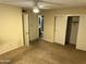 Carpeted main bedroom with ceiling fan, closet and private bathroom at 564 N Santa Anna St, Mesa, AZ 85201