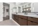 Bathroom with double sink vanity, granite countertop, and marble lined shower at 5744 E Lowden Rd, Cave Creek, AZ 85331