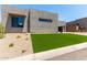 Modern home featuring desert landscaping with an artificial lawn at 5744 E Lowden Rd, Cave Creek, AZ 85331