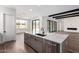 Bright open concept with a kitchen island featuring a dishwasher, sink, and black faucet at 5744 E Lowden Rd, Cave Creek, AZ 85331