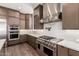 Gourmet kitchen featuring stainless steel appliances, a gas range, and modern cabinetry at 5744 E Lowden Rd, Cave Creek, AZ 85331