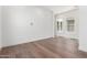 Open living area with hardwood floors, natural light, and crisp, white walls at 5744 E Lowden Rd, Cave Creek, AZ 85331