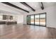Open-concept floor plan connecting living room and kitchen, with large sliding glass doors to the backyard at 5744 E Lowden Rd, Cave Creek, AZ 85331
