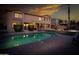 Resort-style backyard with a refreshing pool, tropical landscaping, and an inviting patio at 7156 S Forest Ave, Gilbert, AZ 85298