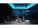 Spin room features modern bikes and blue ambient lighting at 7156 S Forest Ave, Gilbert, AZ 85298